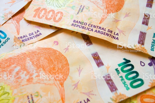 Close-up macro of bills of 1000 Argentine pesos disordered